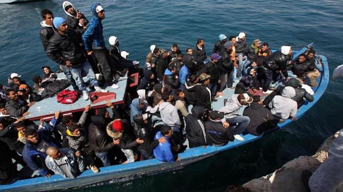 Refugee boat on the coast of Lampedusa